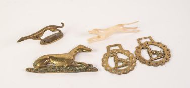 FOUR SMALL PIECES OF GREYHOUND RELATED BRASS, including a MATCHING PAIR OF HORSE BRASSES and a