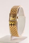 OMEGA 18ct GOLD LADY'S BRACELET WRISTWATCH with tiny square dial with baton numerals, in case,