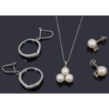 A pair of contemporary diamond set hoop earrings