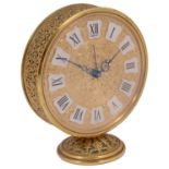 A Jaeger gilt brass circular alarm clock
