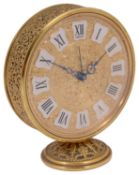 A Jaeger gilt brass circular alarm clock