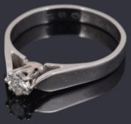 A delicate single stone diamond set ring