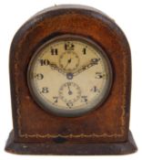 An early 20th century gilt tooled leather arched desk clock