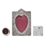 A late Vict. silver photograph frame together with a square silver ashtray and a stamp wetter