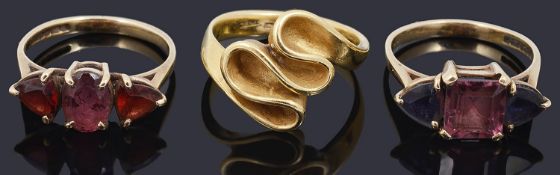 A Continental 18ct gold modernist design ring and two other rings