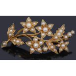 An attractive Victorian half pearl set floral spray brooch