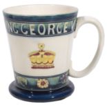 A Moorcroft pottery George VI 1937 Coronation Commemorative Mug