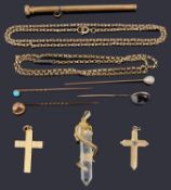 A small selection of gold and yellow metal jewellery to include stone set sticks pins