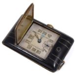 An Art Deco black enamel and gilt purse watch