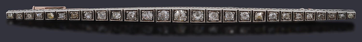 An Edwardian long diamond set bar brooch