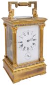 An early 20th century French large gilt brass four pane carriage clock