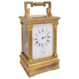 An early 20th century French large gilt brass four pane carriage clock