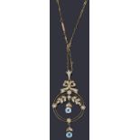 An Edwardian aquamarine and seed pearl drop pendant on chain