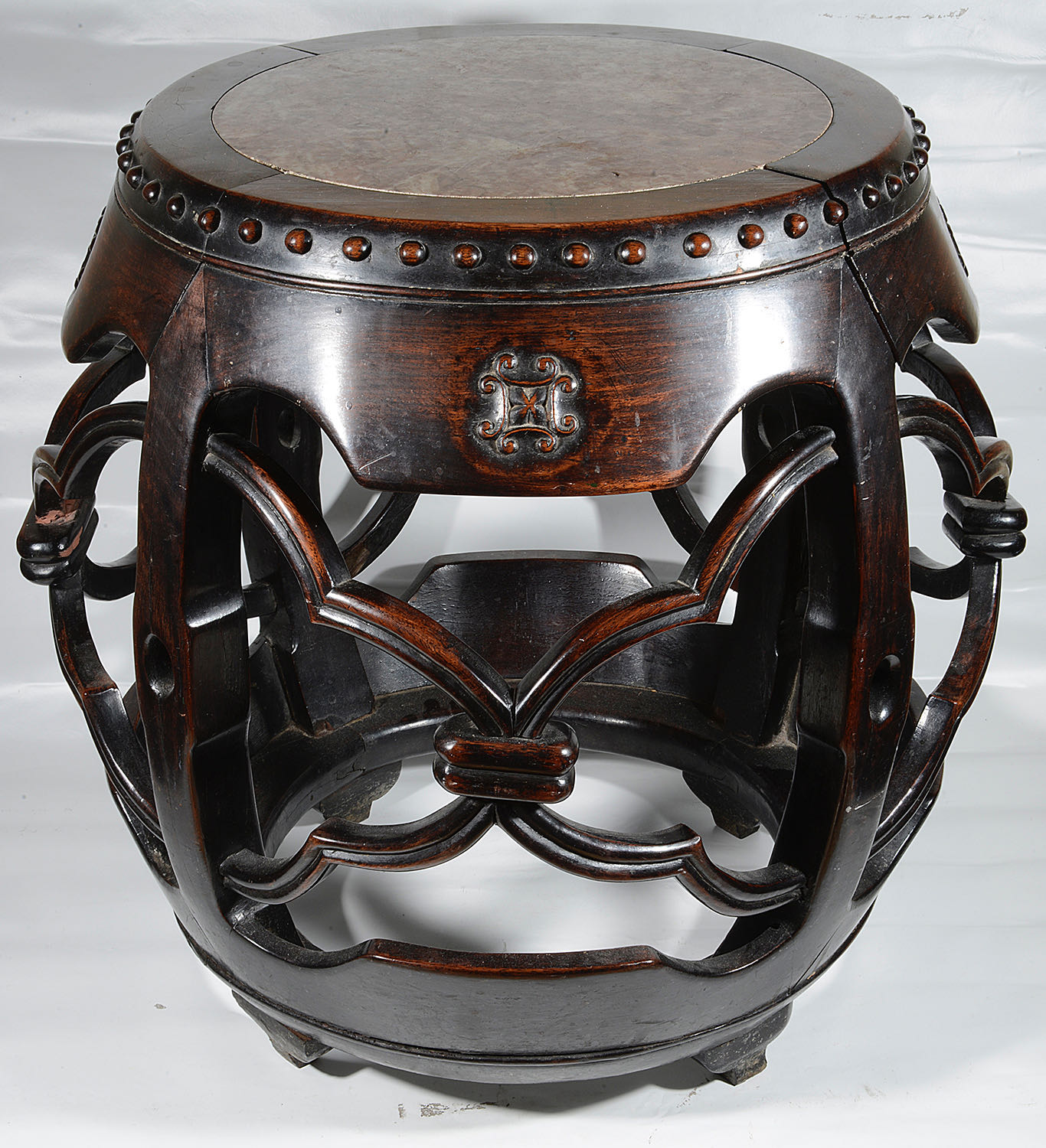 A late 19th century Chinese carved hardwood barrel shaped stand - Image 2 of 3