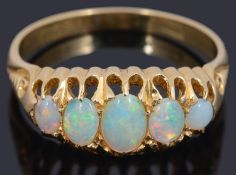 An attractive antique 18ct gold set five stone opal set ring