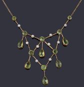 An attractive Edwardian peridot and seed pearl drop necklace