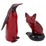 A Royal Doulton flambé penguin and fox