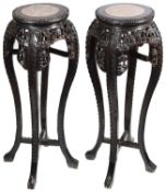 A pair of late 19th century Chinese hardwood jardiniere stands