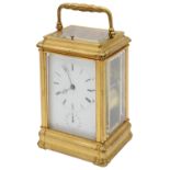 A late 19th c French ormolu four pane repeating carriage clock with alarm