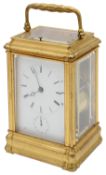 A late 19th c French ormolu four pane repeating carriage clock with alarm