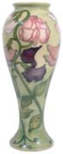 A modern Moorcroft Collectors Club 'Sweet Pea' pattern vase designed by Sally Tuffin