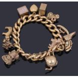 A 15ct gold curb link bracelet suspended with various charms