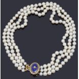 An attractive three stand cultured pearl necklace with diamond and enamel clasp