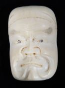 A Japanese Meiji period noh mask netsuke