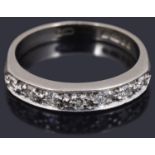 A delicate diamond set half eternity ring