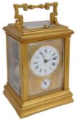 A late 19th century French ormolu repeating carriage clock