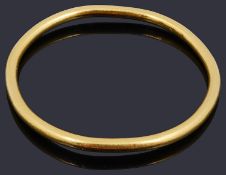 A Chinese 20th century plain yellow metal slave bangle