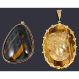 A contemporary diamond set cameo relief pendant