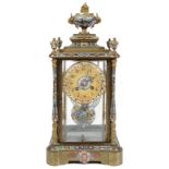 A late 19th c French gilt brass and champleve enamel four glass mantel clock