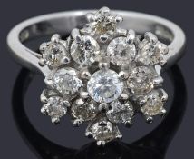 A contemporary 18ct white gold diamond set 'snowflake' cluster ring