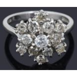 A contemporary 18ct white gold diamond set 'snowflake' cluster ring