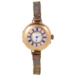 A small 18k gold ladies half hunter wristwatch