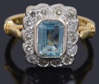 An aquamarine and diamond set rectangular cluster ring