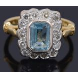 An aquamarine and diamond set rectangular cluster ring