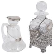 A late Vict. small cut glass decanter contained in a silver stand and