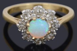 A Continental opal and diamond daisy cluster ring