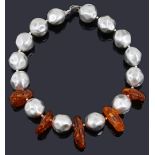 A contemporary chunky single row silver and amber bead necklace