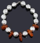 A contemporary chunky single row silver and amber bead necklace