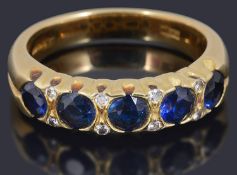 A sapphire and diamond set half eternity ring