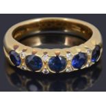 A sapphire and diamond set half eternity ring