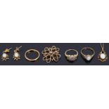 A small collection of gold jewellery including a diamond and gem set heart ring