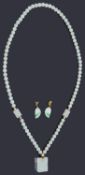 A contemporary Chinese pale celadon jade bead necklace