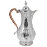 A late Victorian George III style silver hot water jug