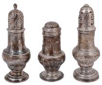 A George II silver bun top pepper pot and two George II silver ogee baluster form sugar casters