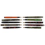 A large collection of early to mid 20th c mottled and plain fountain pens and propelling pencils