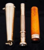 A 9ct gold cheroot case and 9ct gold cigar piercer